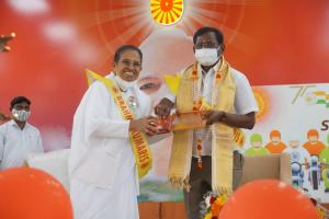 Rajyogini Ambika Didi presenting Godly gift to Shri T Narayan,Corporator